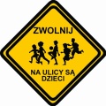 Znak ZWOLNIJ Na ulicy są dzieci