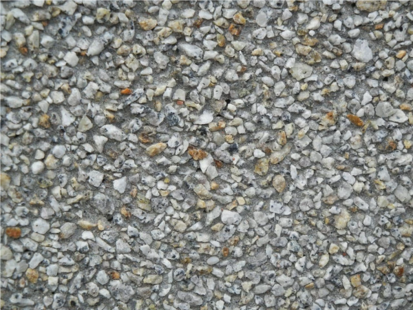Faktura betonu płukanego – Ciemnoszary granit z rudymi akcentami